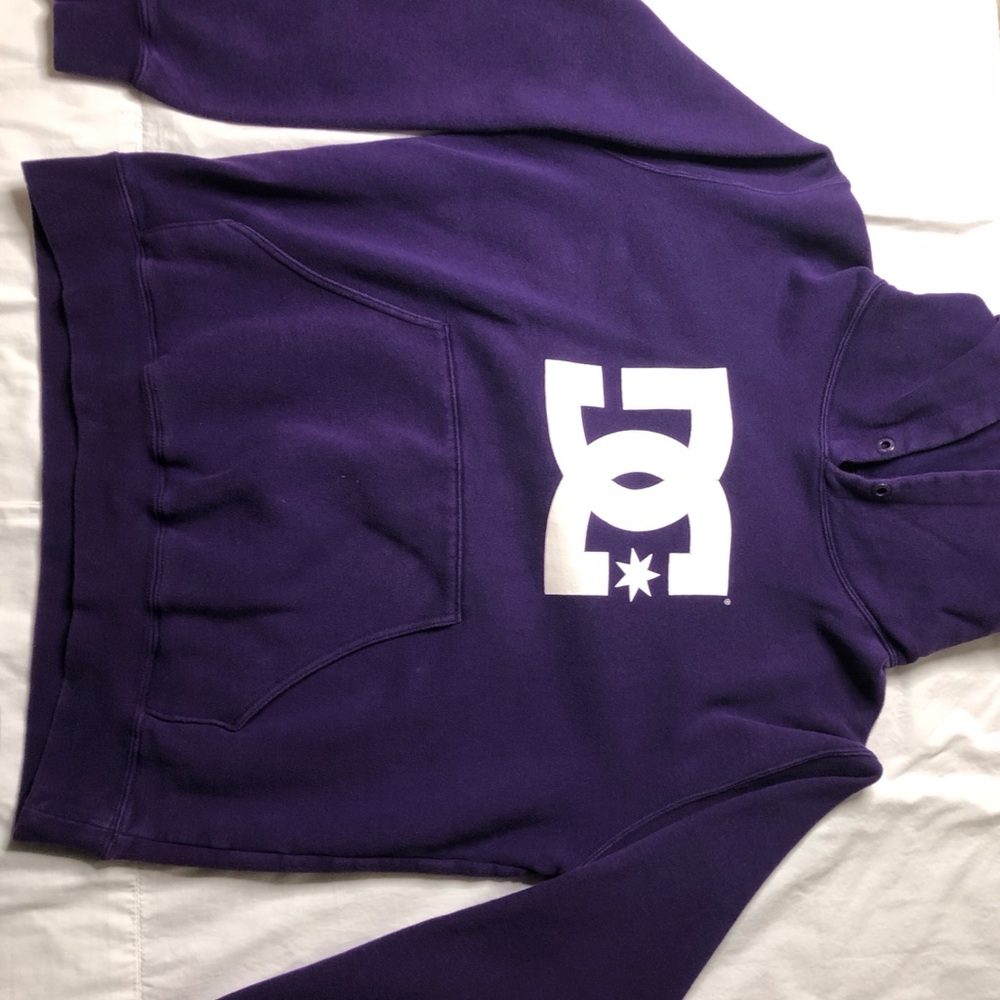 a big purple hoodie.